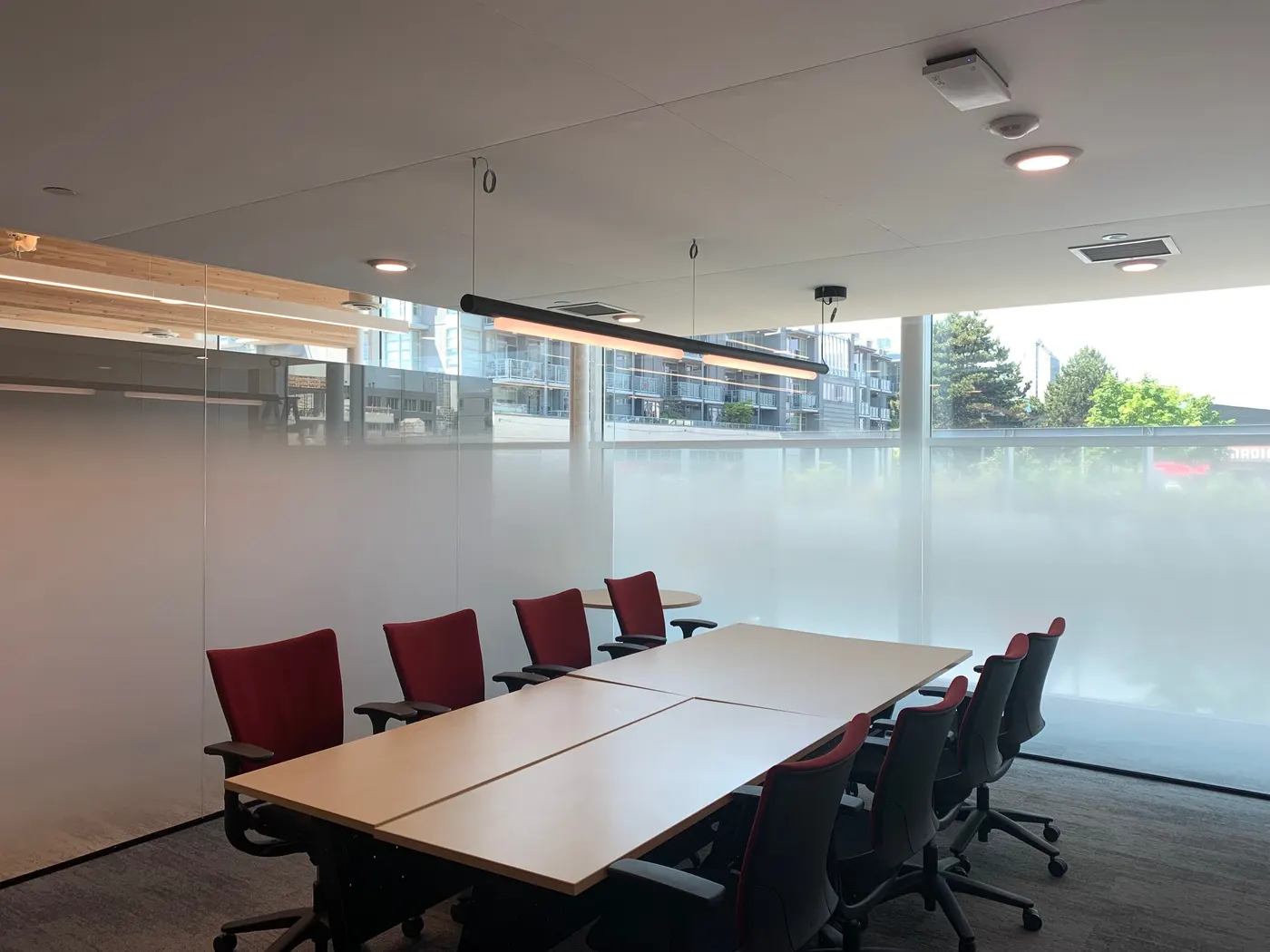 Decorative frosted privacy film on office glass partition