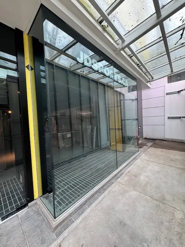 Security window film installation on a commercial storefront